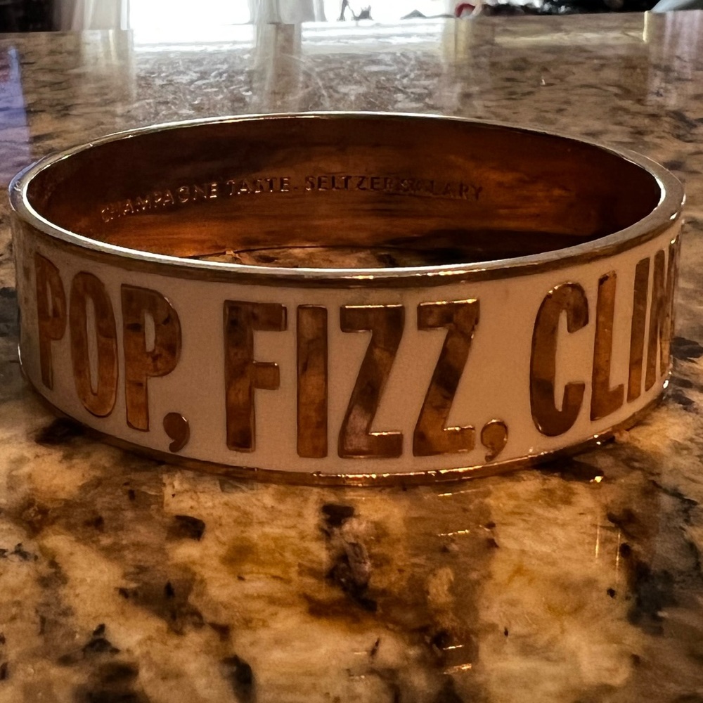 Kate spade idiom bangle “pop fizz clink” gold and white